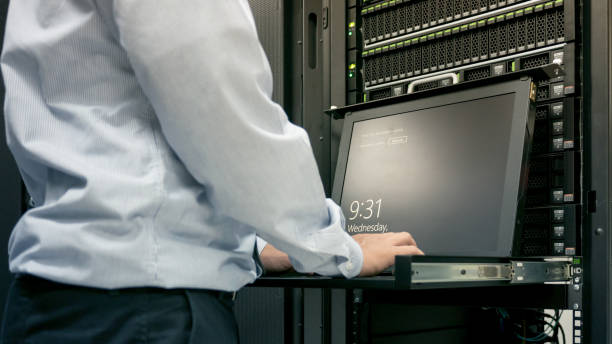 istock Close up part of administrator working in data center 821957422