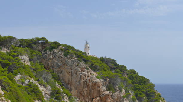 istock Lighthouse on top of a mountain 821962160