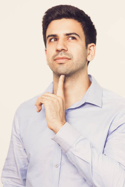 istock Dreamy Young Handsome Man Touching Chin 821962236