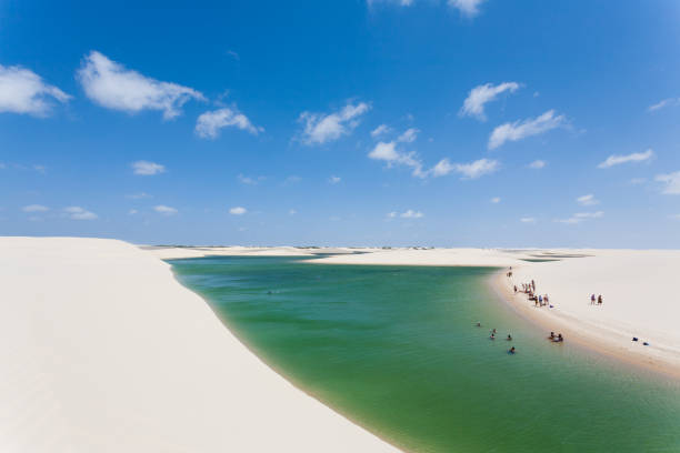 White sand dunes panorama from Lencois Maranhenses National Park, Brazil. White sand dunes panorama from Lencois Maranhenses National Park, Brazil. Rainwater lagoon. Brazilian landscape brazil desert maranhao state national park stock pictures, royalty-free photos & images