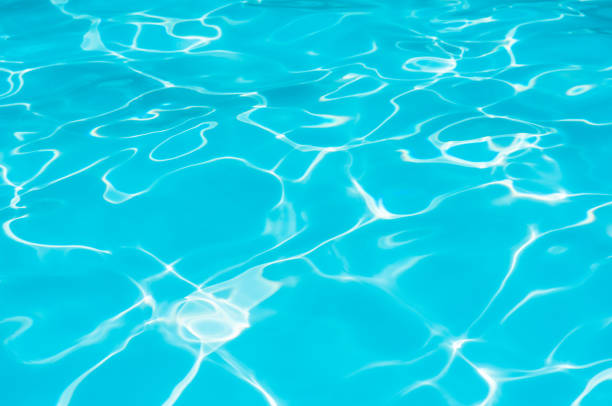 istock Beautiful ripple wave and blue water surface in swimming pool 821986976