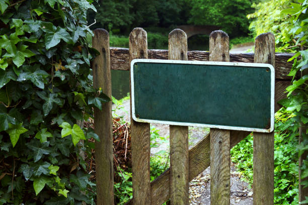 istock A wooden gate with sign board 821996530