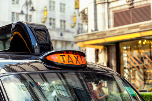 istock Black cab waiting outside a hotel on The Strand in London 822010820
