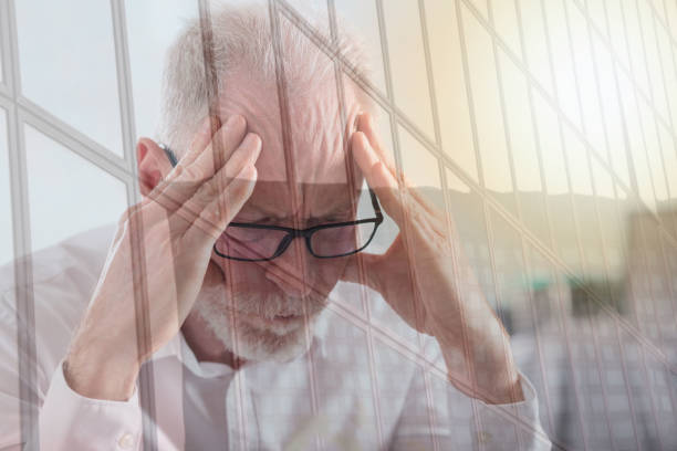istock Tired senior businessman, double exposure, light effect 822022560