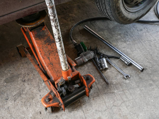 istock lifted car by car jack tool for maintenance 822027284