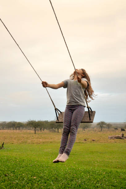 istock girl on the swing 822034248