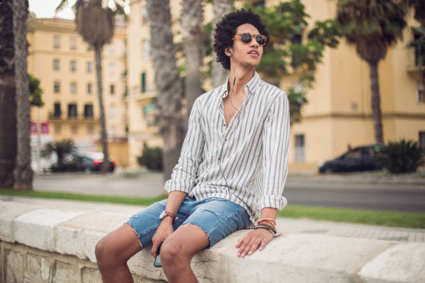 istock Young man listening music 822039866