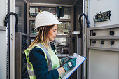 istock Female Energy Station Electrician Engineer Read Notes 822044000