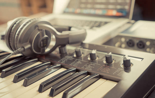 istock Home studio working desk with keyboard and headphone 822045594