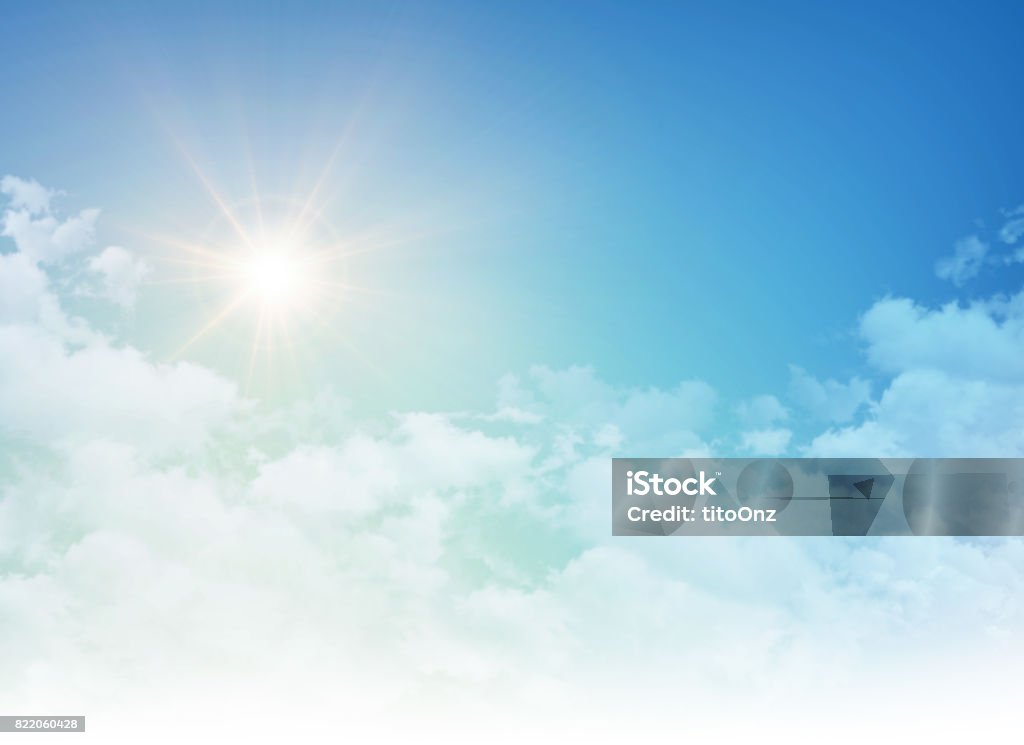 Rising sun in a cloudy blue sky Early morning blue sky in sunrise, white clouds vanishing away Sky Stock Photo