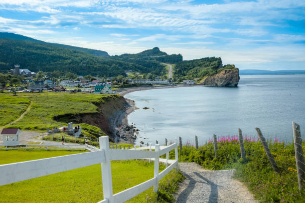 Coast of  Gaspe Peninsula at Perce, Quebec, Canada with blue waters of the Gulf of St. Lawrence Coast of  Gaspe Peninsula at Perce, Quebec, Canada with blue waters of the Gulf of St. Lawrence Merged Panoramic HDR image. gaspe peninsula stock pictures, royalty-free photos & images