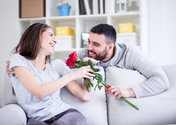 istock Man giving a red rose to his girlfriend 822060842