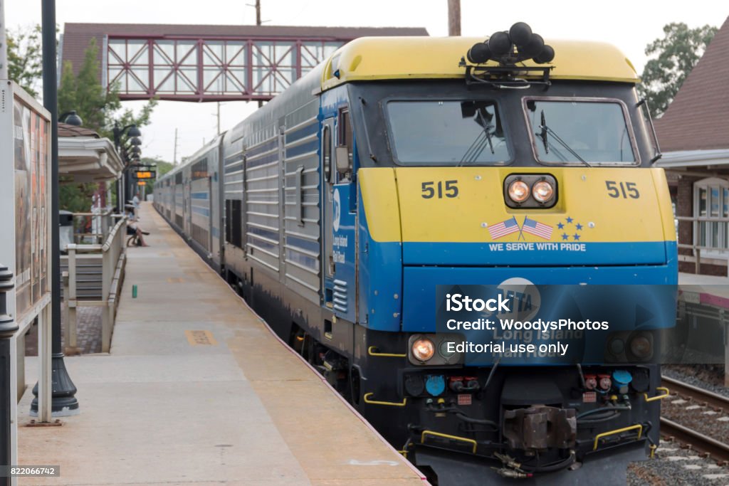 Long Island Railroad Train arriving in Bay Shore Bay Shore, NY, USA - 29 June 2017: A double decker train arrives at the Bay Shore train station the week before the Summer of hell is to begin. Long Island Railroad Stock Photo