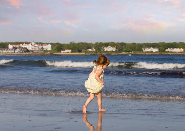 istock Toddler Girl Playing on the Beach 822070350
