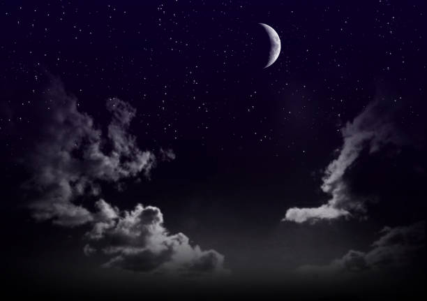 istock Beautiful magic blue sky with clouds and moon and stars at night closeup 822092078