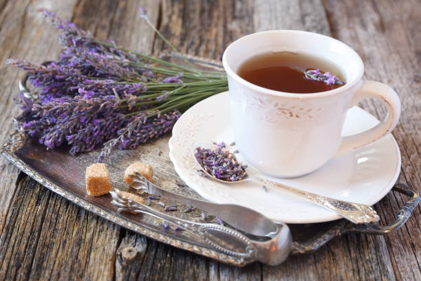 istock Lavender tea and fresh lavender on vintage tray 822105148