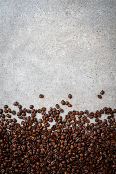 istock Roasted coffee beans on gray stone background. 822122778