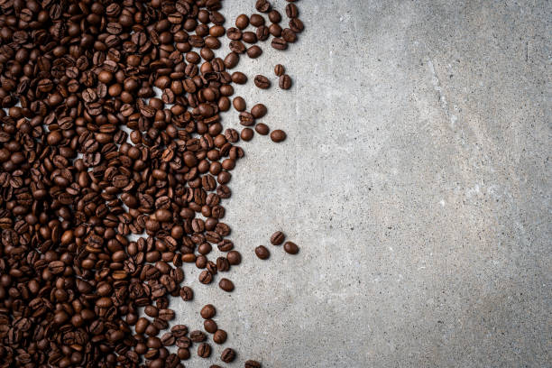 istock Roasted coffee beans on gray stone background. 822123102