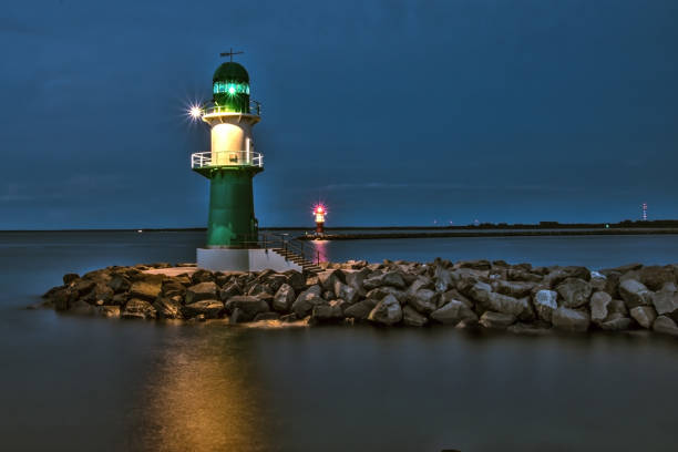 guardians of the harbour lighthouses at the baltic sea at night lighthouse lighting equipment reflection rock stock pictures, royalty-free photos & images
