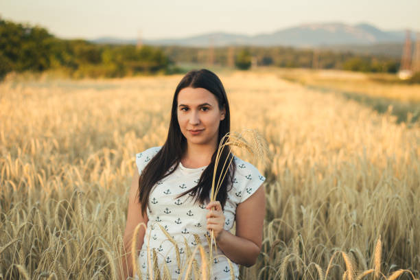 istock Beautiful girl in a wheat field. 822143268
