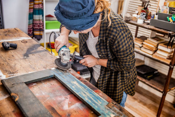 istock Creative Young Woman Restoring the Vintage Frame 822153676