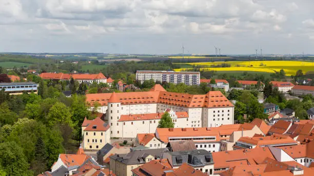 High angle view of the castle of  Freiberg, Germany, seen from the tower of the church St. Peter, in the background the university campus