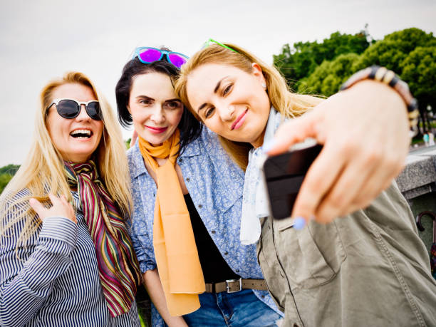 istock Group of mid age women in public park 822165678