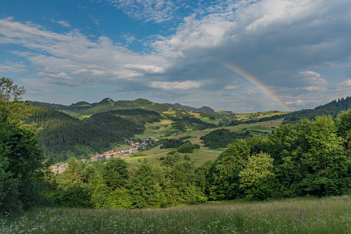 Valley near Lesnica village after storm with rainbow