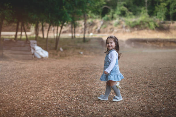 istock Side view baby girl in nature 822186392