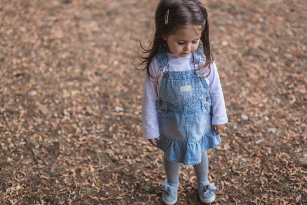 istock Sad young girl standing in nature 822186522