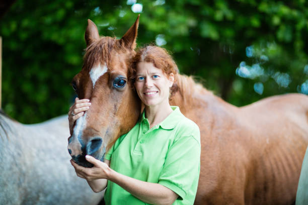 istock Veterinarian smiling with horses 822190082