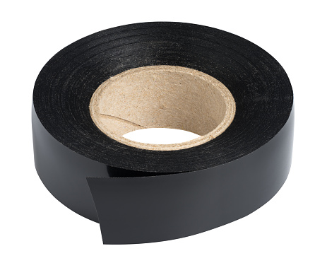 Roll of black plastic duct tape on white background, isolated