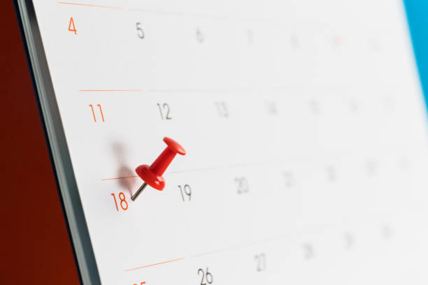 istock Close up red pin on white calendar. 822225296