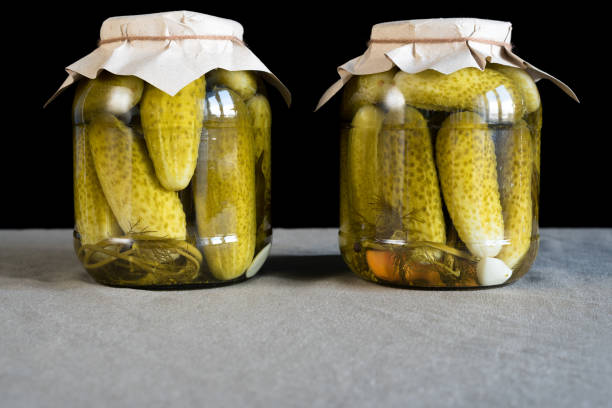 istock Fresh pickled cucumbers on black background, homemade preserved vegetables 822237150