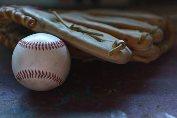 istock Worn Baseball and Glove 822238260