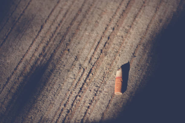 istock Cigarette stub on the floor with sunlight,Quit smoking concept. 822245258