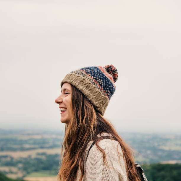 istock Woman Smiling Mountain Carefree Cloudscape Concept 822256712
