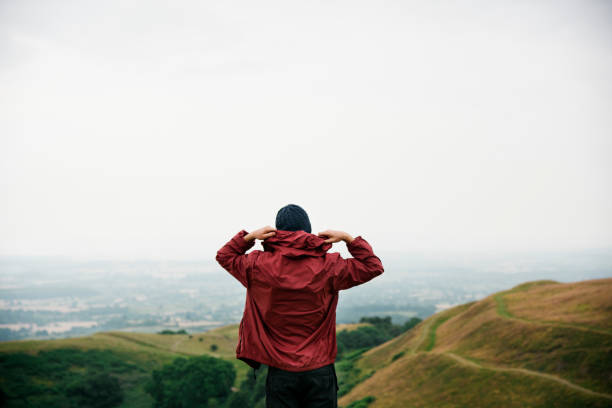 istock Man Rear View Top Mountain Carefree Cloudscape Concept 822257452
