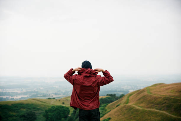istock Man Rear View Top Mountain Carefree Cloudscape Concept 822257518