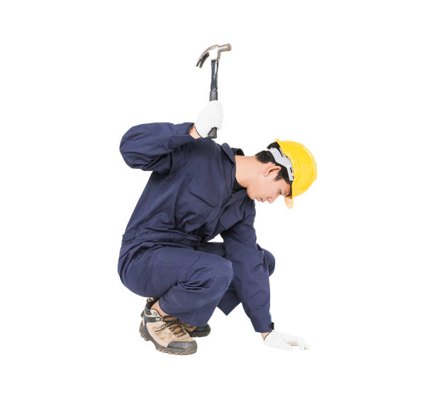 istock Handyman in uniform with his hammer 822265314
