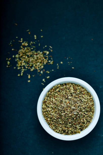 istock Dried oregano herbs in white bowl 822268764
