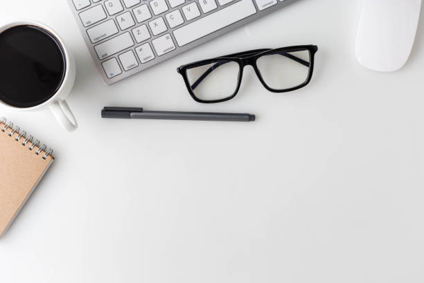 istock Modern White office desk top table with ... and other supplies. Top view with copy space on white background. Top view, flat lay. 822277838