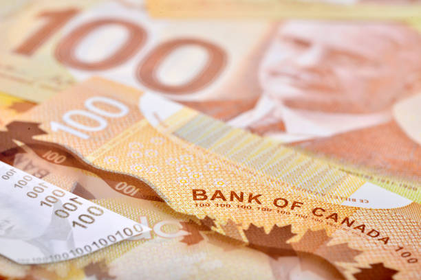 istock One hundred canadian banknotes (CAD) background 822293652
