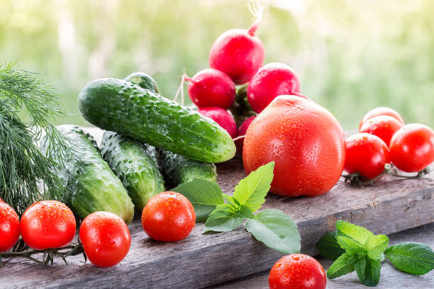 istock Fresh  vegetables  on wood table in the garden 822294662