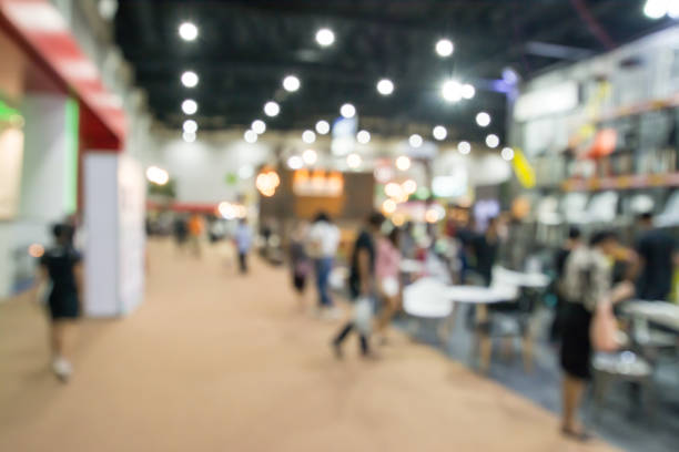 istock Abstract people walking in exhibition blurred background 822300886