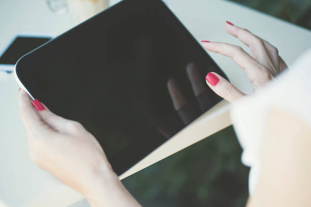 istock Close up of woman's hands using digital tablet 822302064