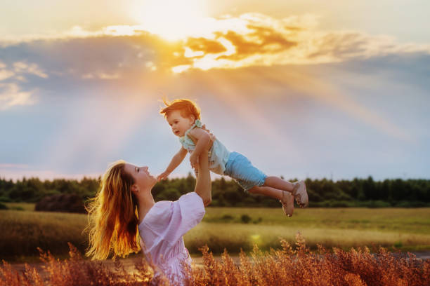 istock mother and her daughter at sunset 822310852
