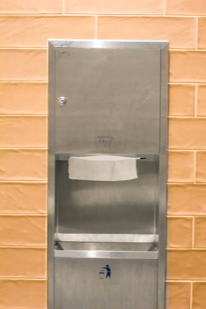 istock Trash and toilet paper  built inside the bathroom orange wall. 822319070