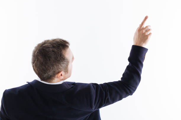 istock Curious elegant gentleman pointing his finger up 822330362