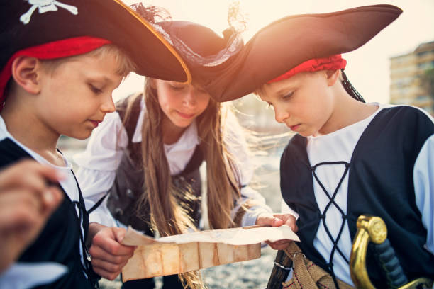 istock Kids playing pirates on a beach 822367136